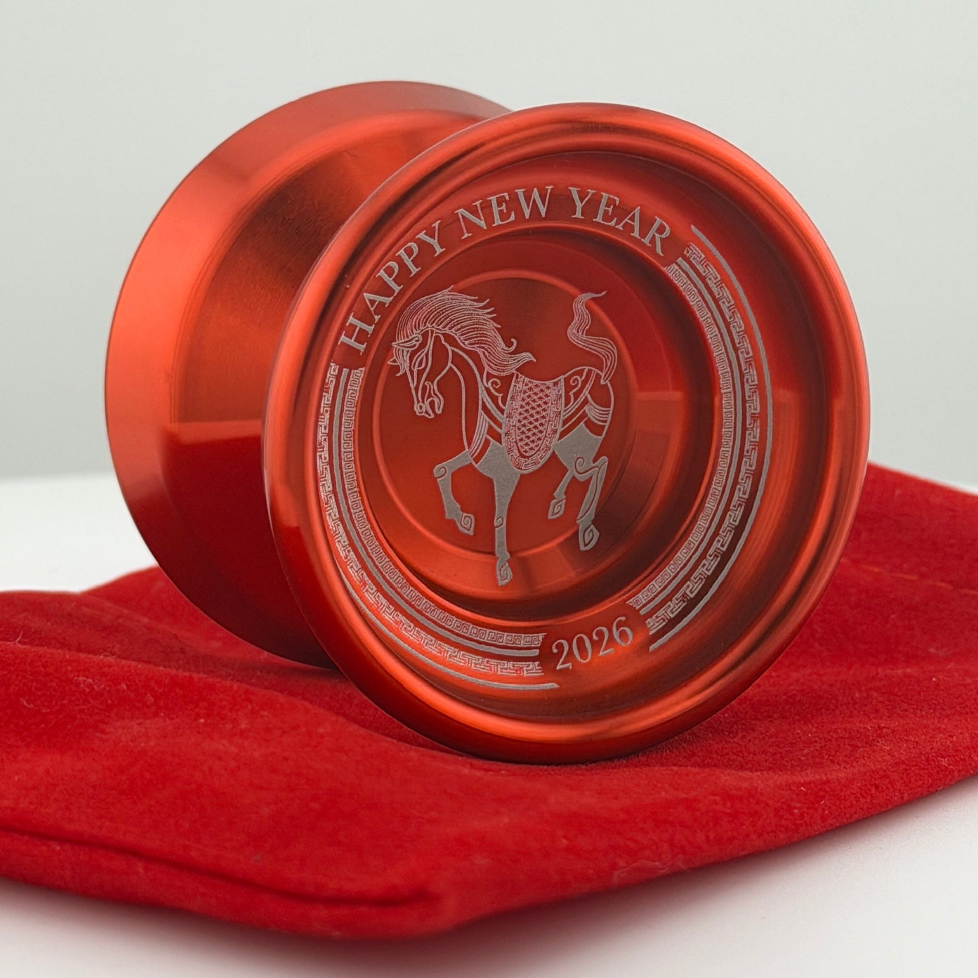 Red 'Happy New Year' yoyo with horse design on a red cloth