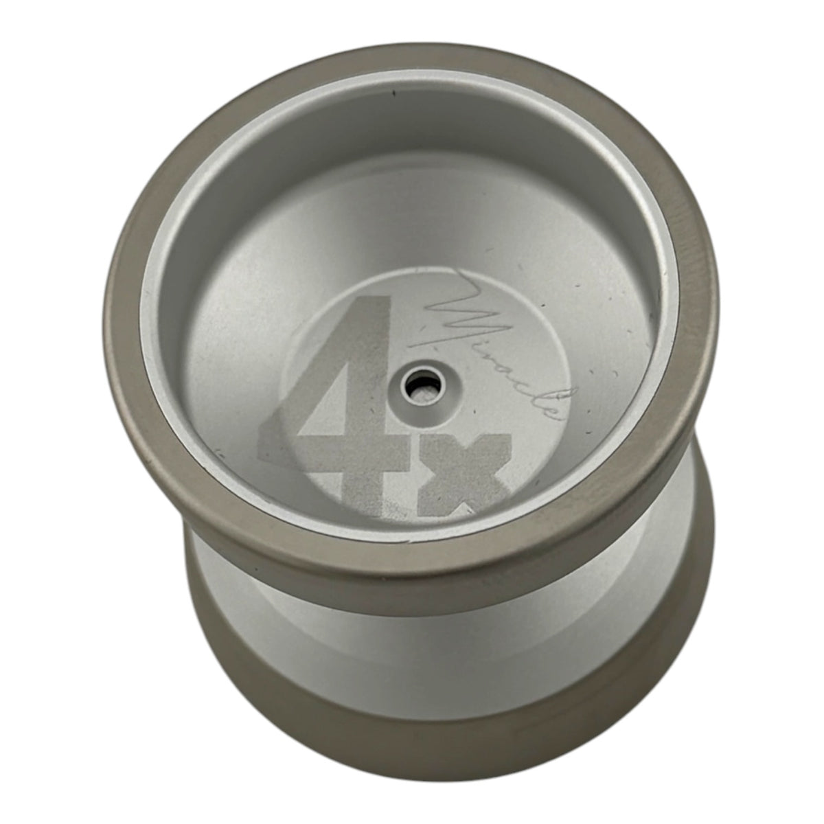 Miracle MINI YoYo 4x - A metallic silver and gray metal yo-yo shown from a top-down perspective on a plain white background.